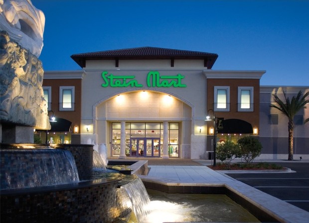 Stein Mart store front with a fountain in front of it